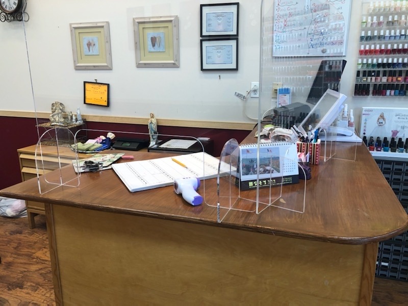 Covid-19 protection measures include plastic shields